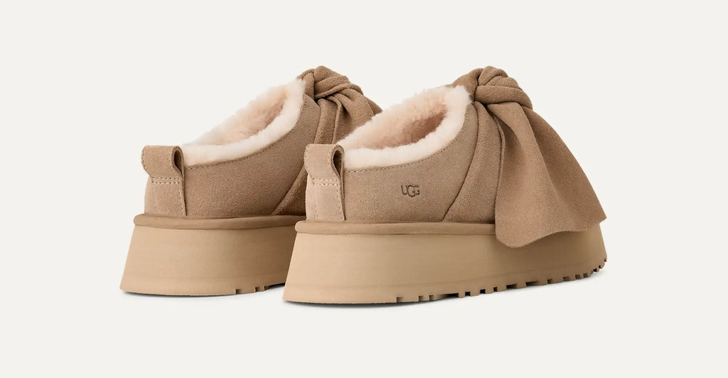 [1176290-SAN] WOMENS UGG PLATFORM SLIP-ON BOW