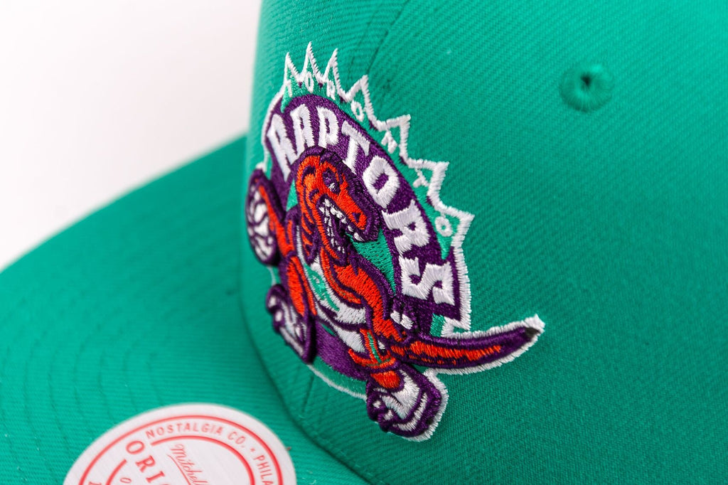 MENS MITCHELL & NESS NBA DESERT GREEN SNAPBACK HWC RAPTORS - TEAL