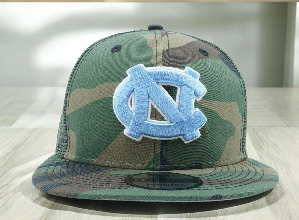 [60269847] MENS NEW ERA NCAA NORTH CAROLINA TAR HEELS 950 CAMO TRUCK D3 SNAPBACK