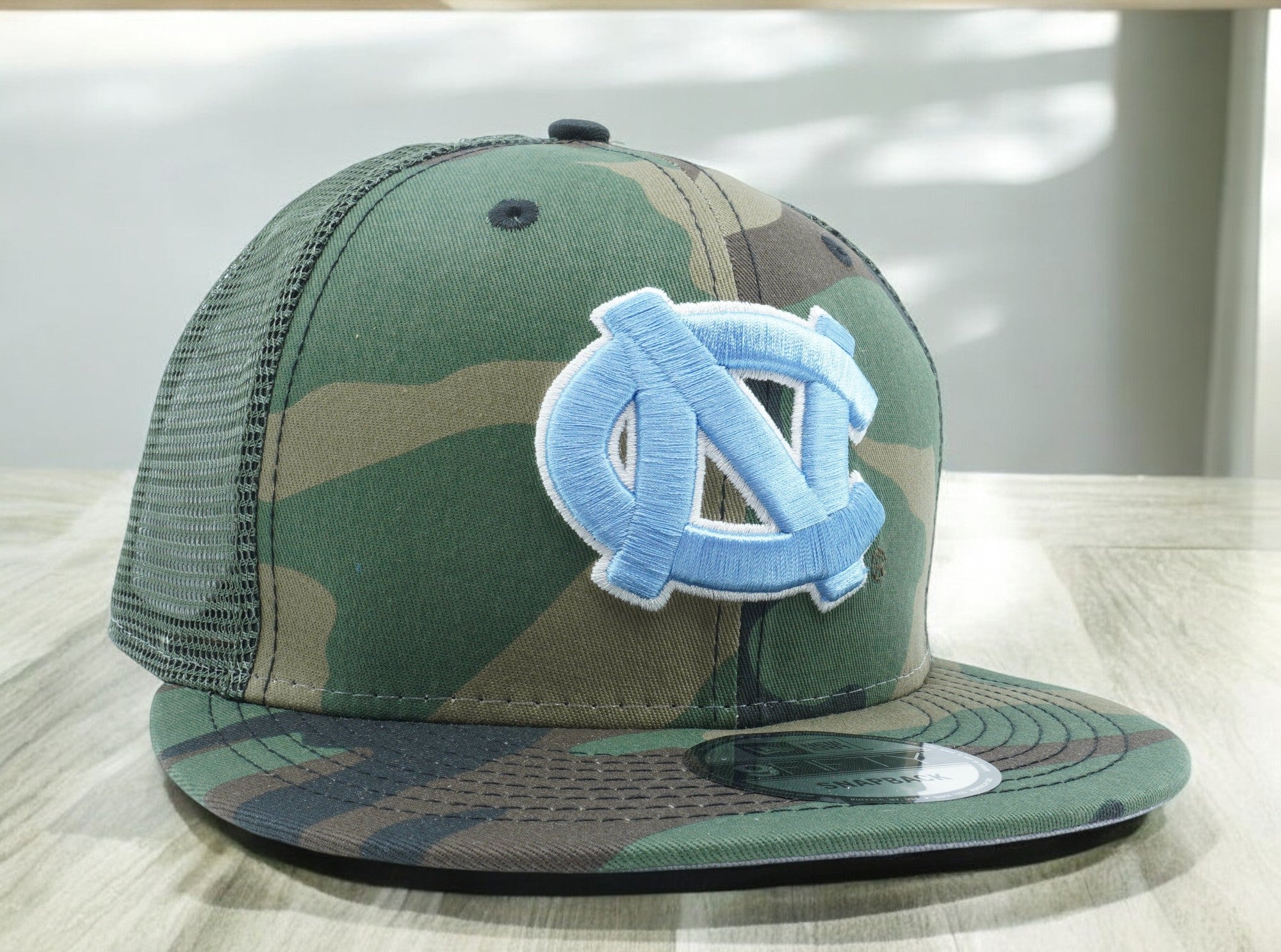 [60269847] MENS NEW ERA NCAA NORTH CAROLINA TAR HEELS 950 CAMO TRUCK D3 SNAPBACK