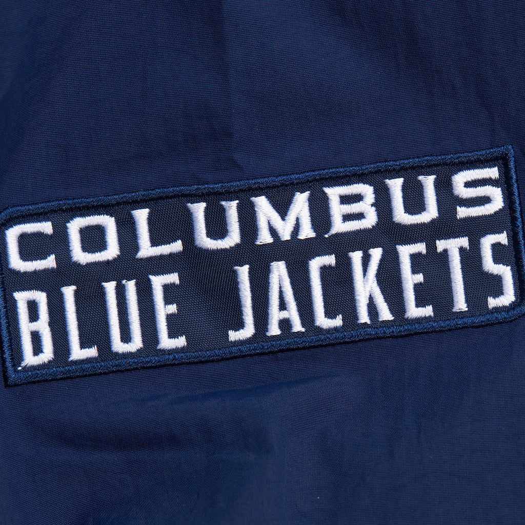 MENS MITCHELL & NESS NHL CLASSIC NYLON PULLOVER CURRENT LOGO BLUE JACKETS