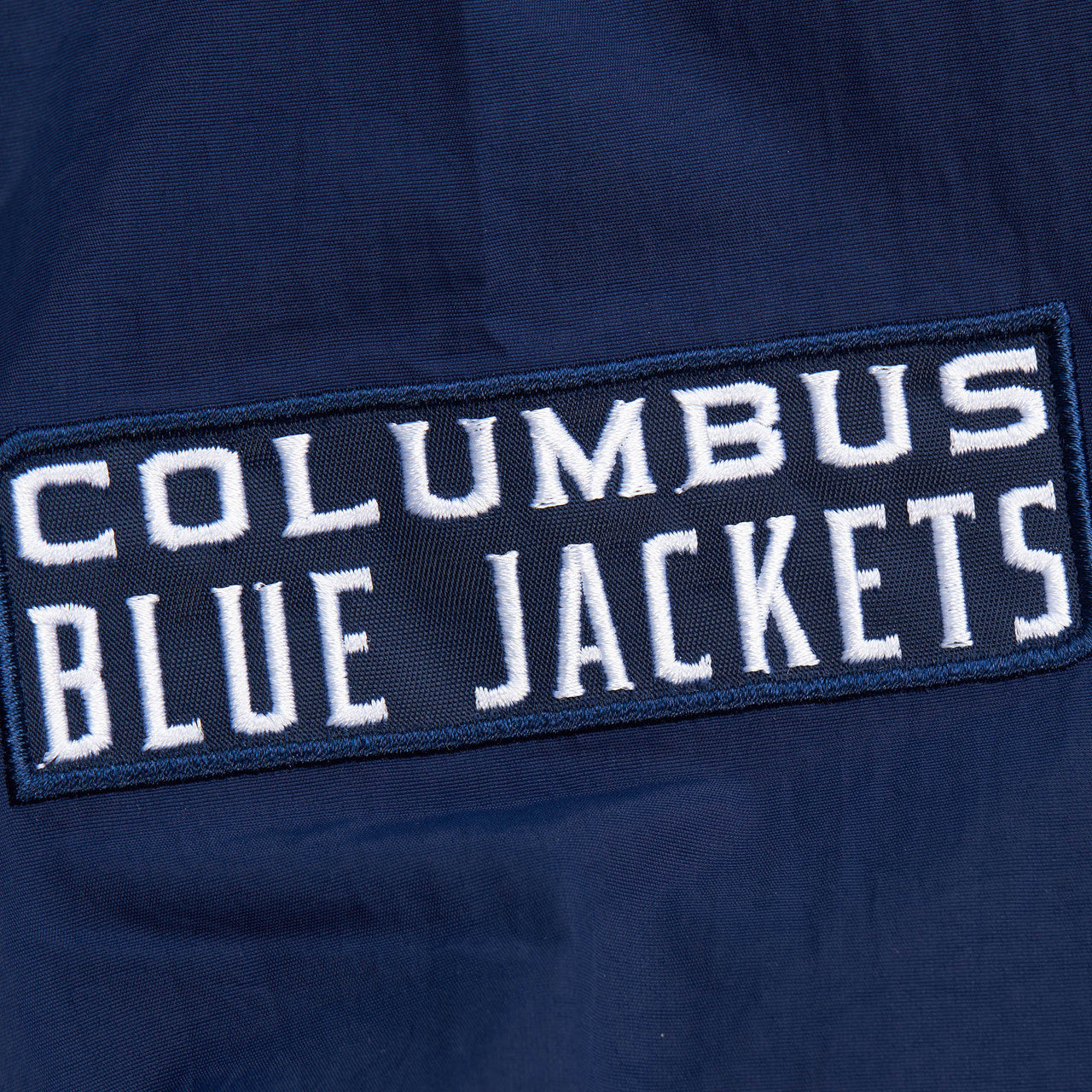 MENS MITCHELL & NESS NHL CLASSIC NYLON PULLOVER CURRENT LOGO BLUE JACKETS