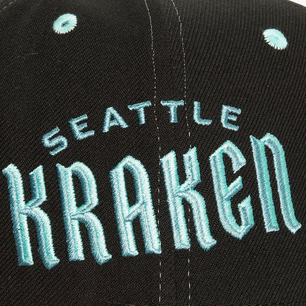MENS MITCHELL & NESS NHL OVERBITE PRO SNAPBACK KRAKEN